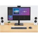 Modern desktop computer setup showcasing media playback on screen, with speakers and accessories for professional digital solutions.